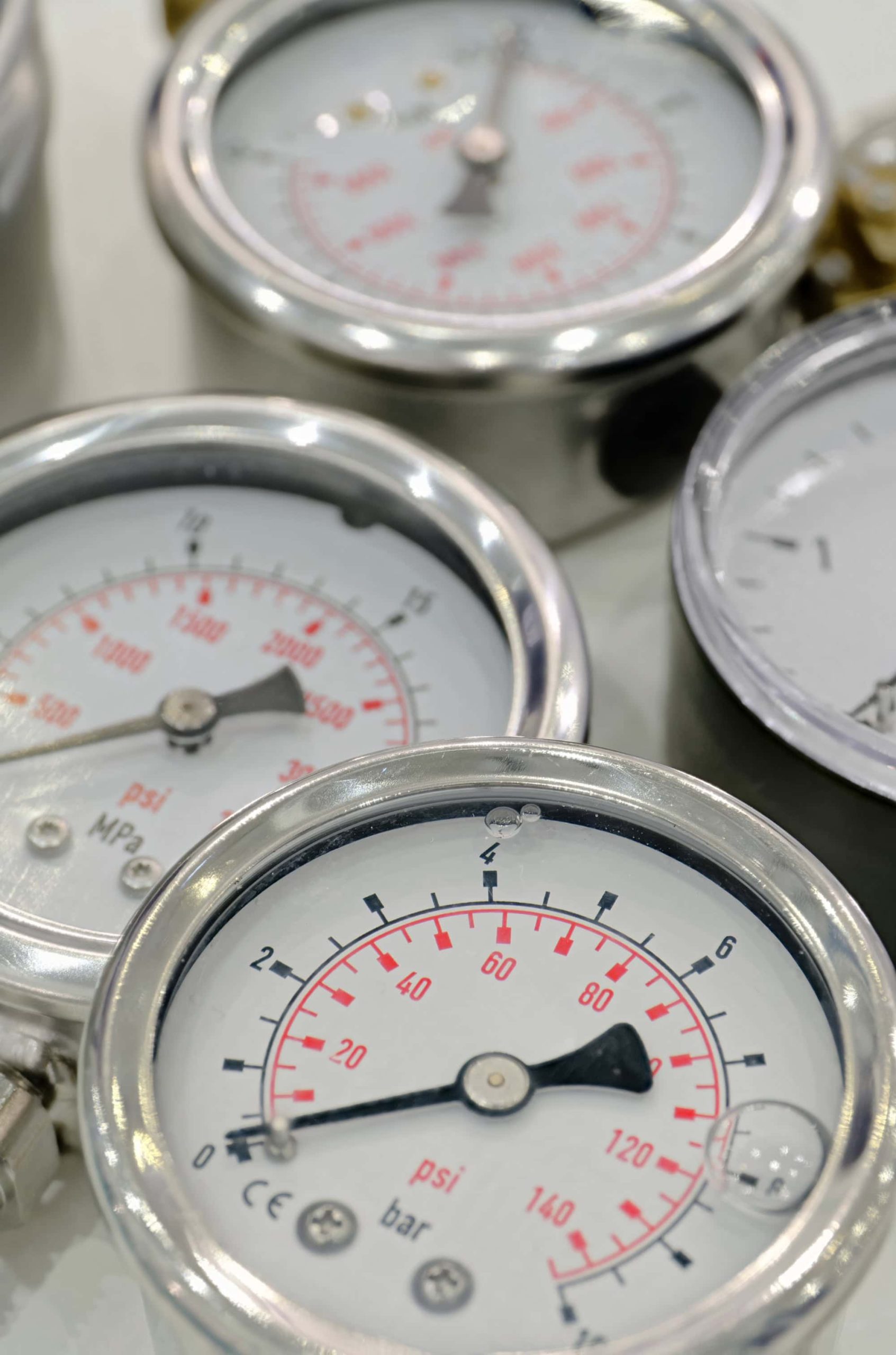 Close-up of precision pressure gauges used in HueLight medical-grade aesthetic and wellness devices"